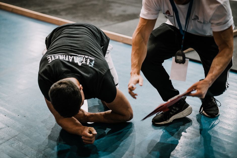 personal trainer coaching gym floor