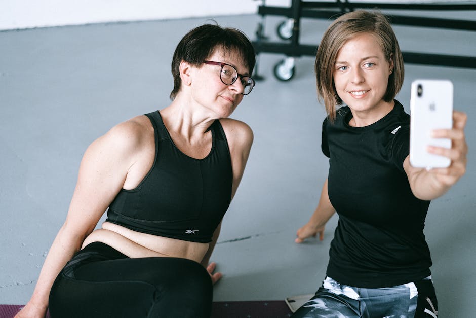 fitness trainer taking selfie with phone social media