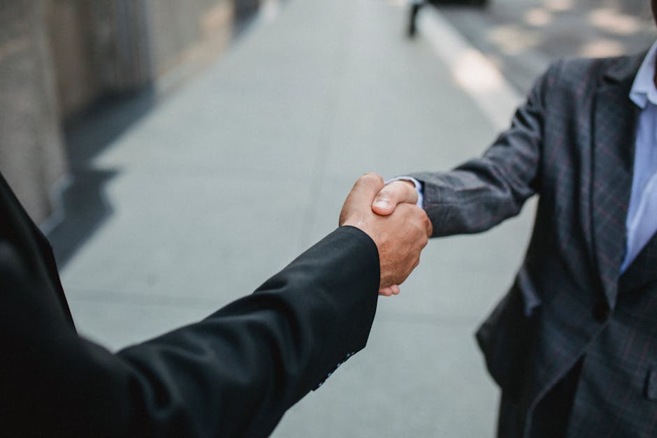 business negotiation handshake fitness industry