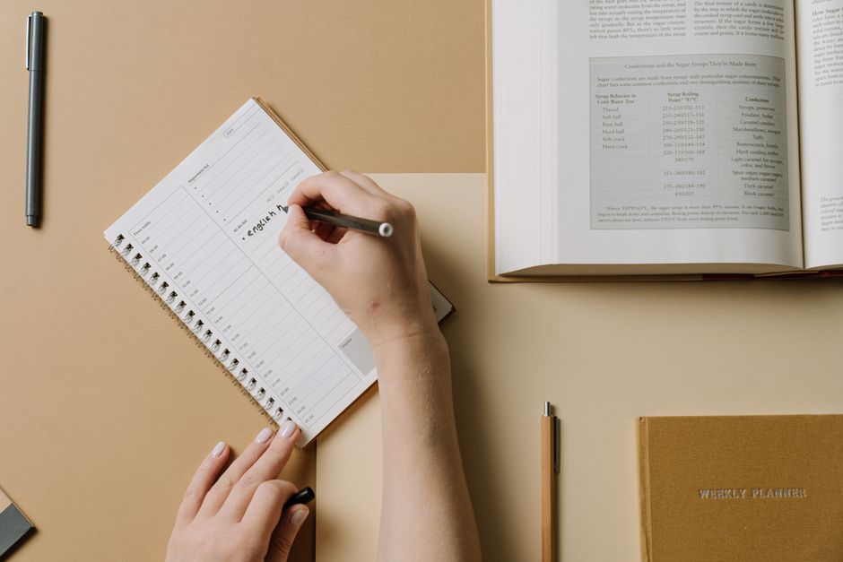 fitness coach writing schedule calendar weekly plan