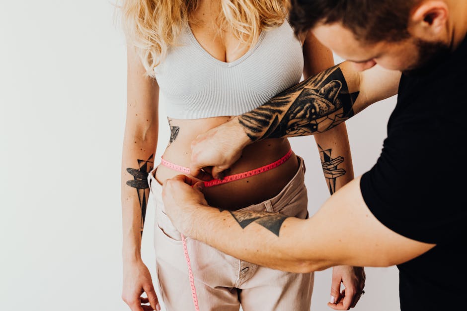 personal trainer measuring client results fitness progress