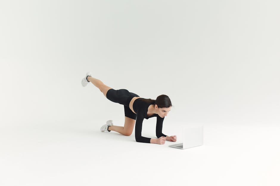fitness trainer working remotely laptop online session