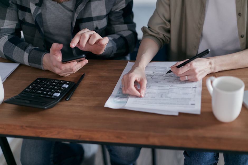 tax documents calculator financial analysis business meeting