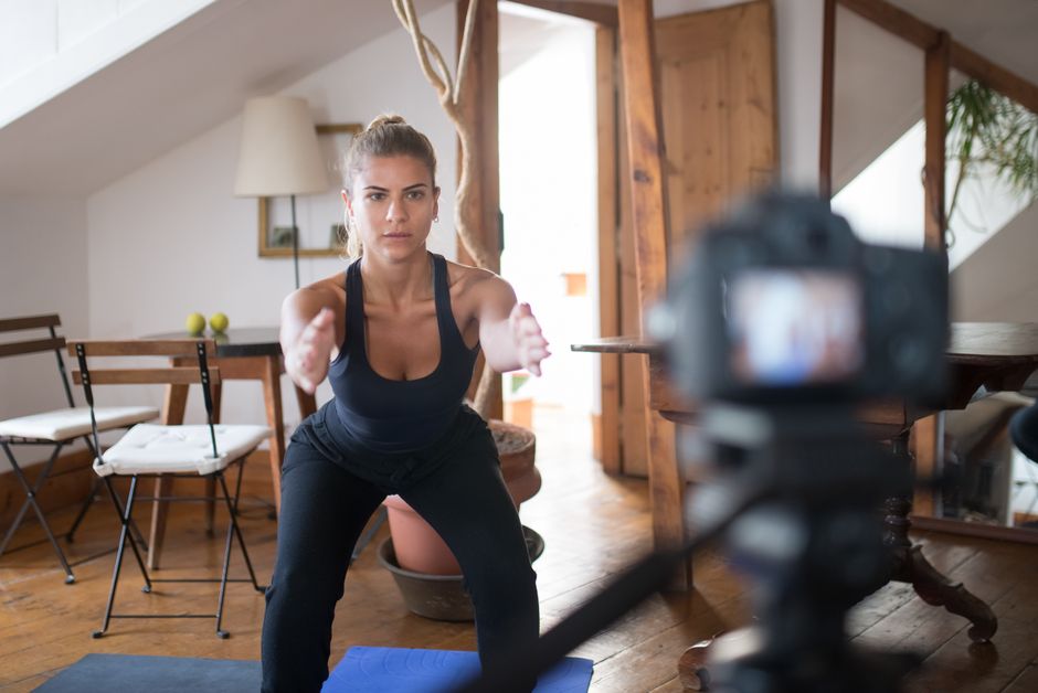 fitness trainer working on laptop content creation
